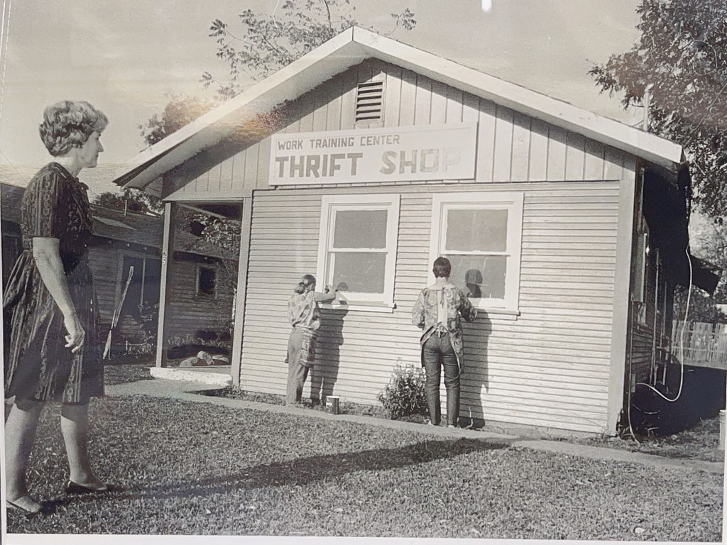 an old photo of a small thrift shop from the 1960s